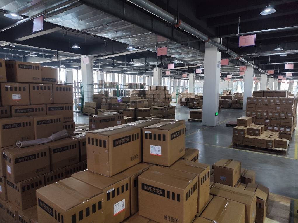 Rows of standard export cartons stacked in the dispatch area, ready for buyer branding